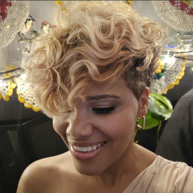 Platinum blonde wavy pixie cut by Triny - elegant textured short-hair styling