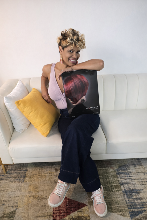 Blonde curly pixie cut by Triny - casual lifestyle styling with product portfolio